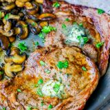 A pan of food on a plate, with Steak
