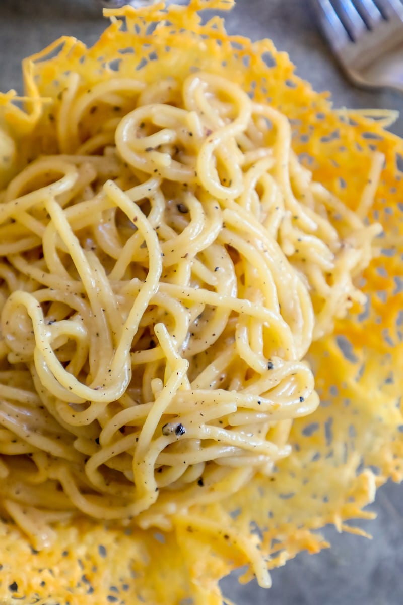 parmesan and pepper creamy pasta in a parmesan bowl on a table