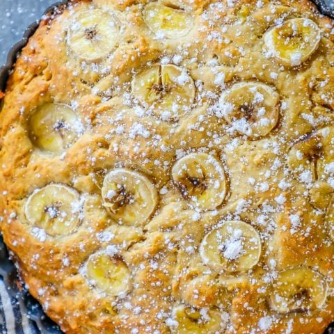 A banana cake with powdered sugar on top and an Apple Banana Bread Recipe.