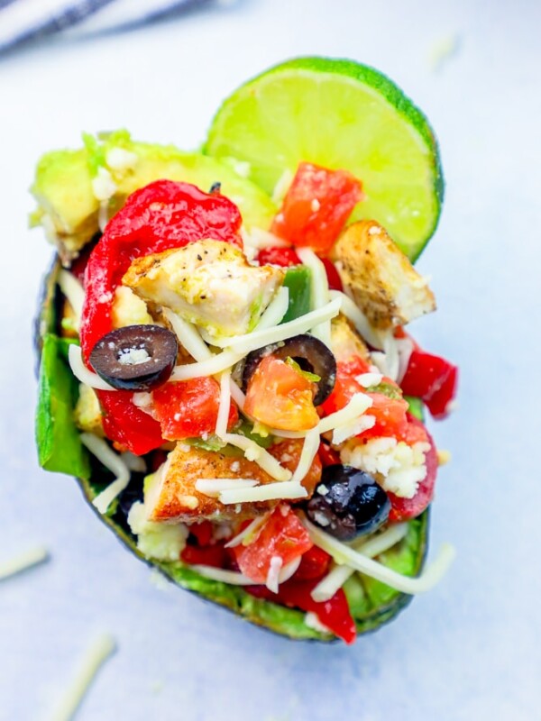 A keto chicken taco avocado stuffed with peppers and olives.
