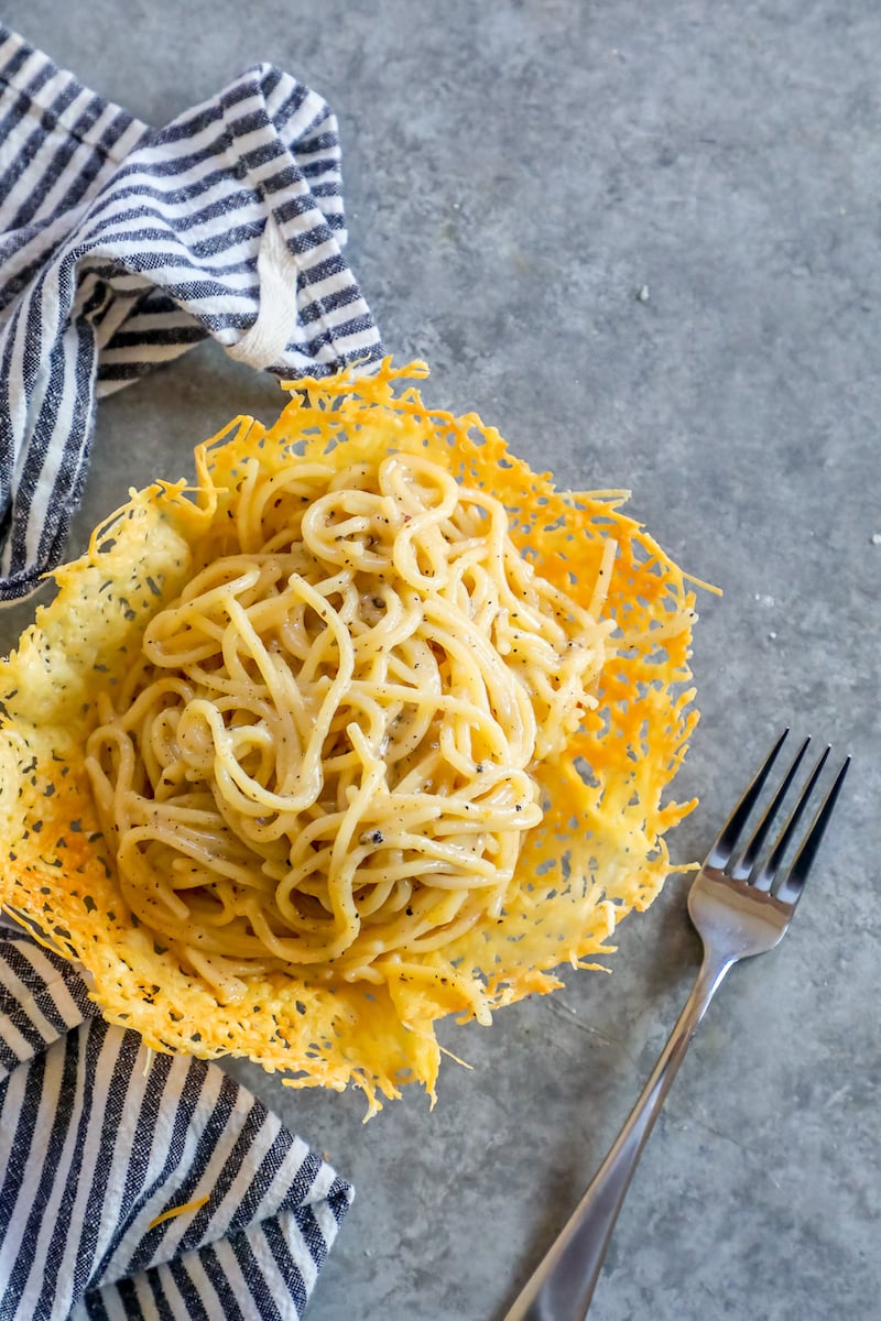 parmesan and pepper creamy pasta in a parmesan bowl on a table