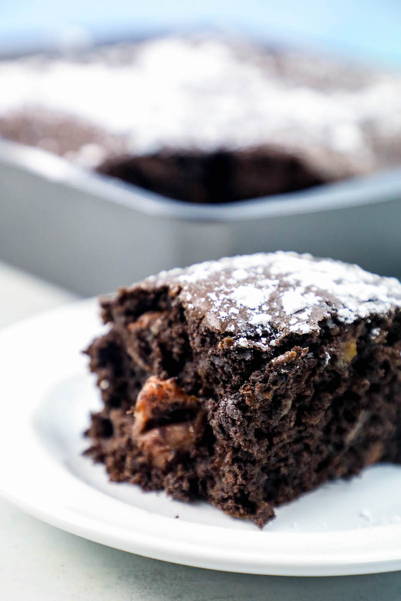 chocolate cake with a caramel filling and powdered sugar on top