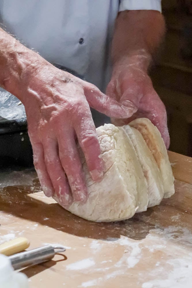 hands making bread