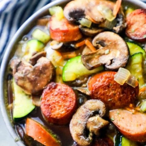 Andouille sausage vegetable soup with zucchini and mushrooms.