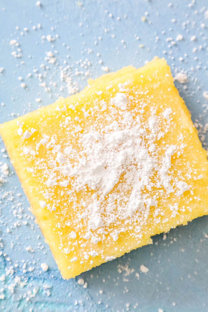 picture of a lemon bar on a blue table