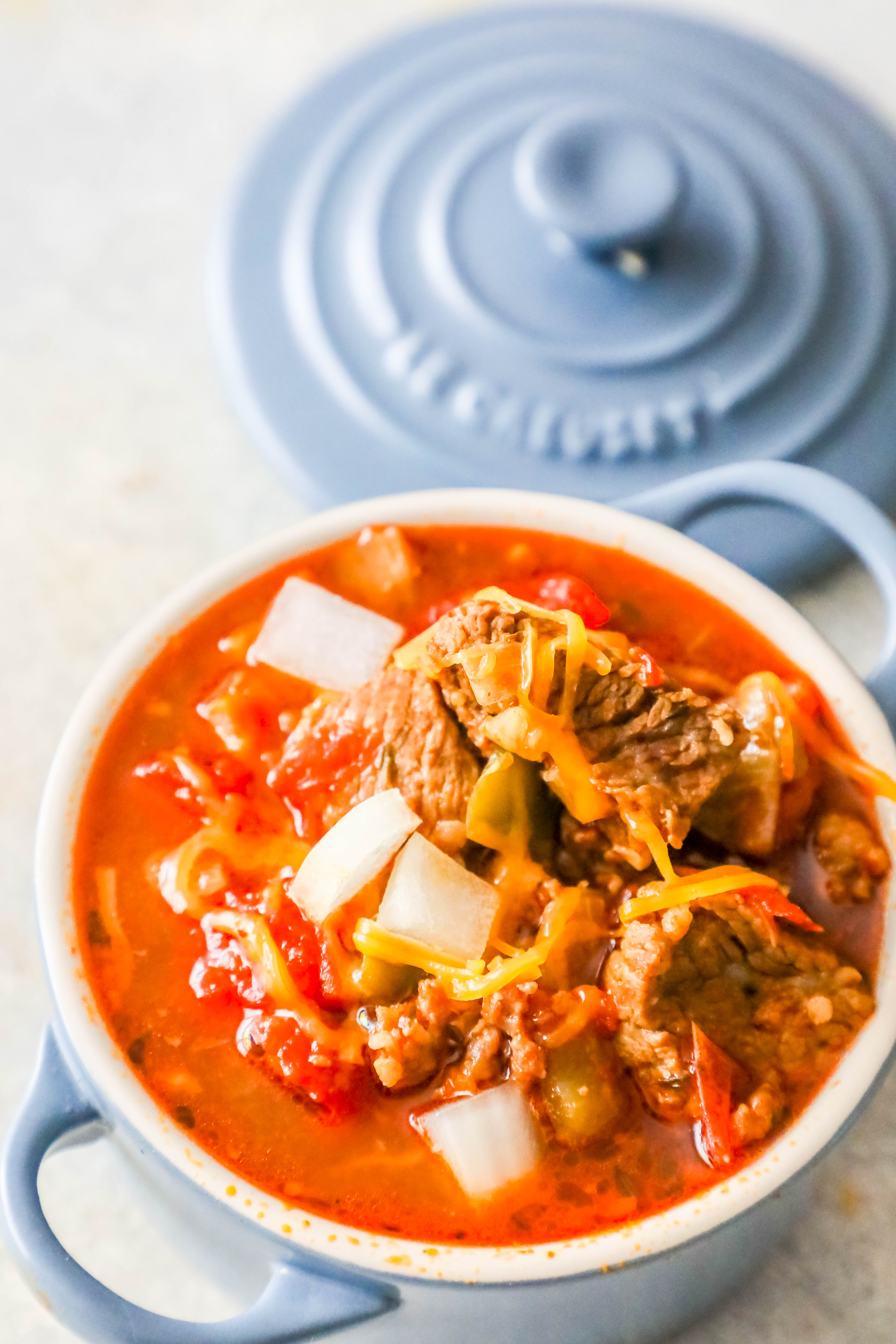 small blue bowl with steak keto chili in bowl 