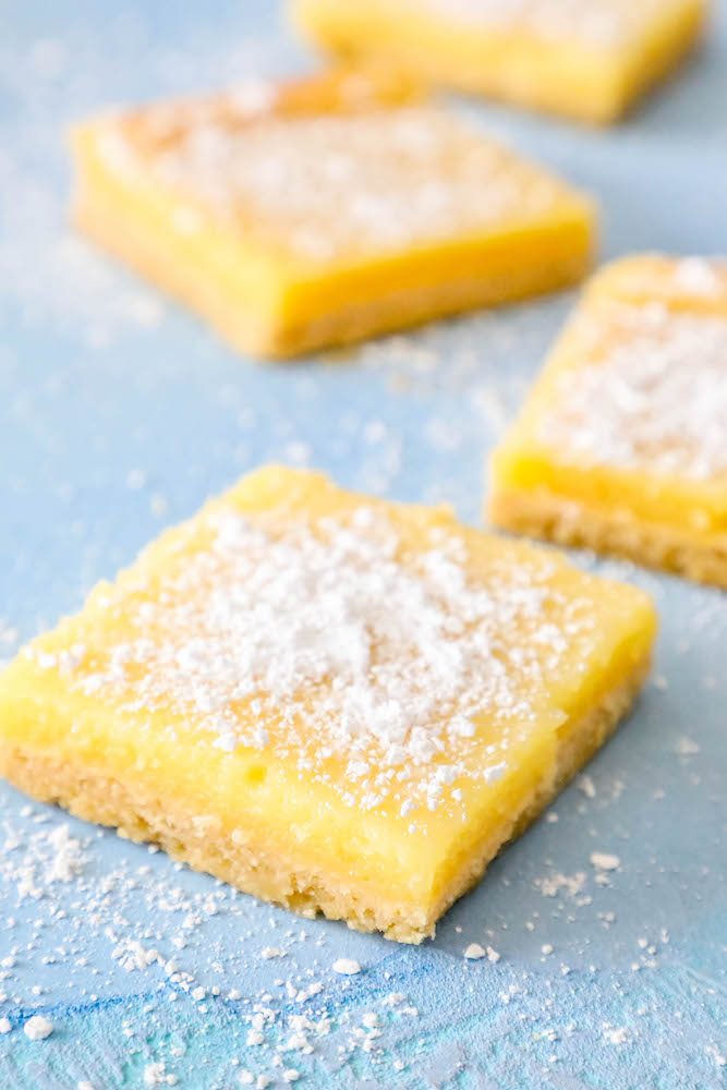 picture of lemon bars laying out on a table 