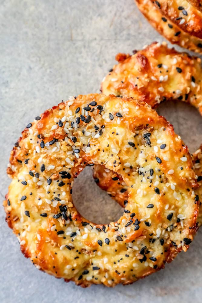 4 everything bagels on a table. 