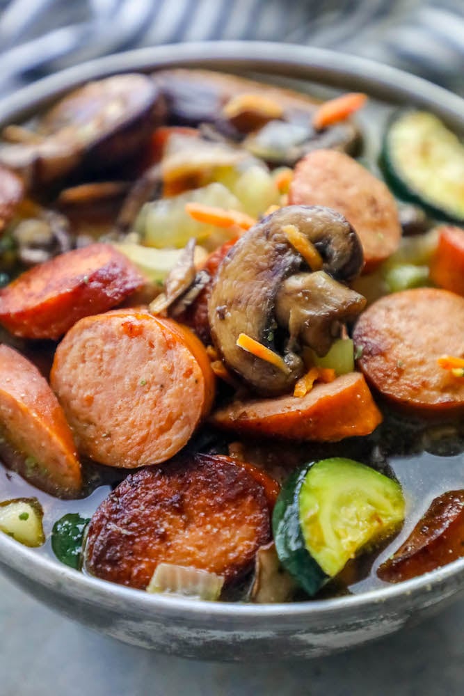 sausage, mushrooms, zucchini in a sauce