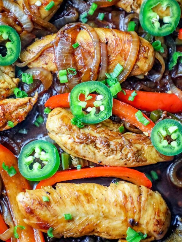 One-pot chicken fajitas cooked in a skillet with peppers, onions, and jalapenos.