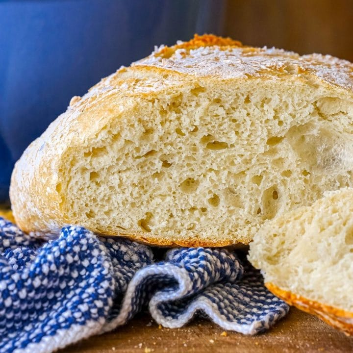 sliced artisan bread loaf on a cutting board