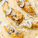 Chicken Stroganoff features tender chicken breasts and mushrooms in a creamy sauce, topped with sliced mushrooms—an easy 20 minute cream cheese chicken dinner shown in close-up.