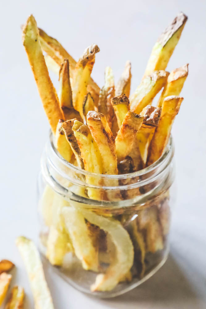 Crunchy fried french fries in a glass jar. 