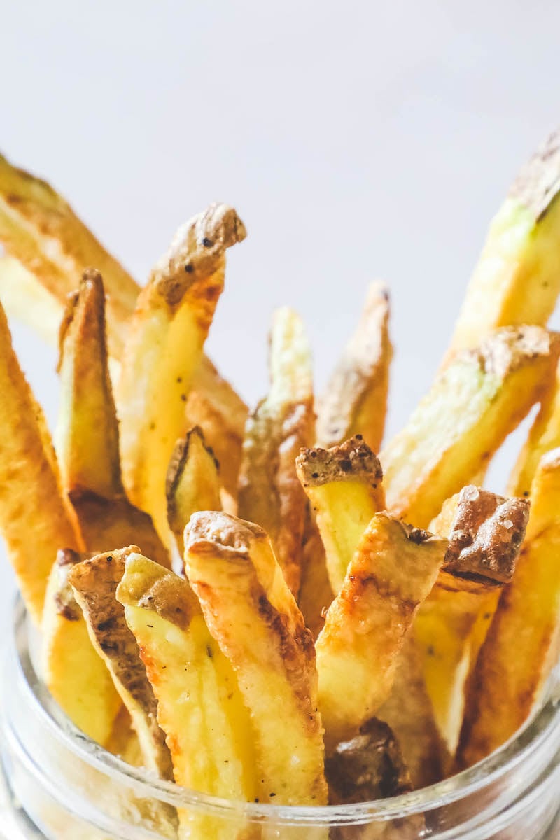 Air fried french fries in a glass jar. 