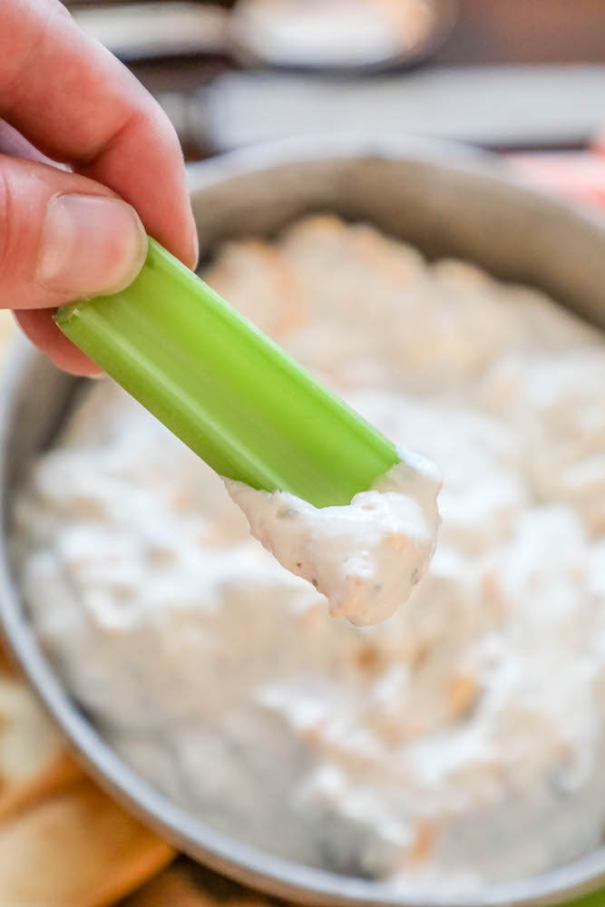 cream dip with some on a piece of celery