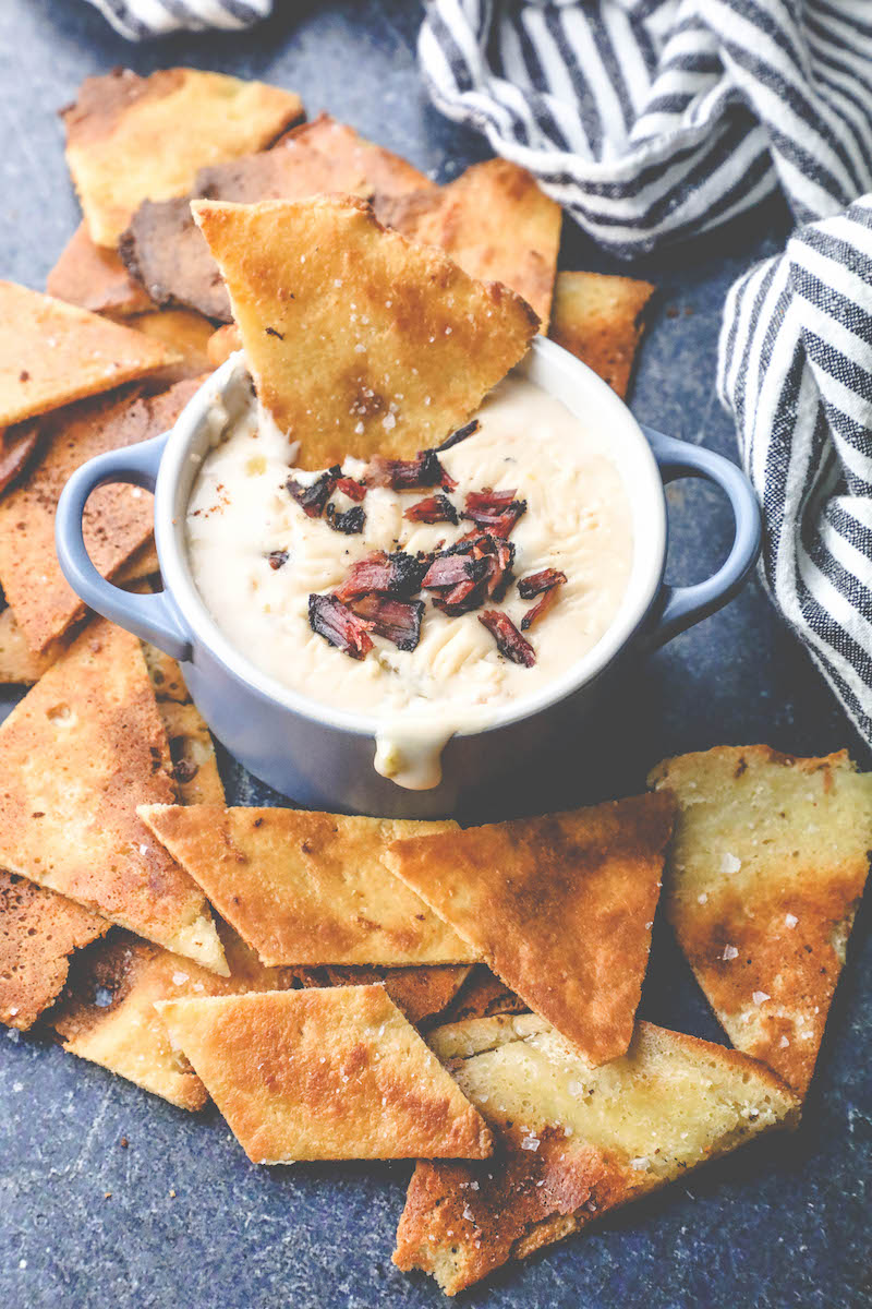 Picture of keto tortilla chips on a plate with dip 