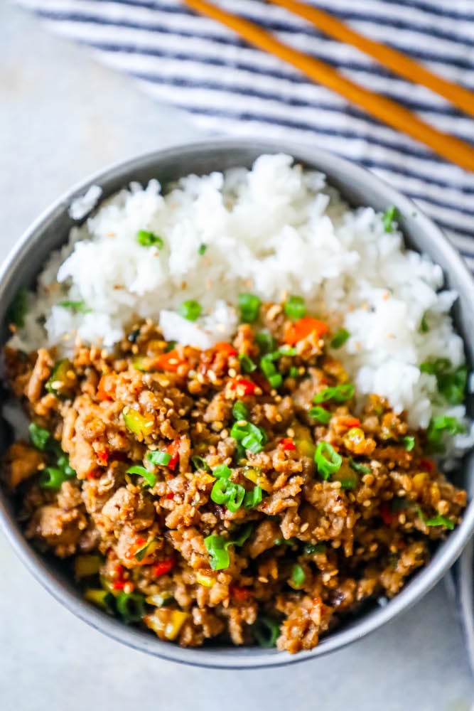 rice in a bowl with ground turkey, green onions, and red bell pepper