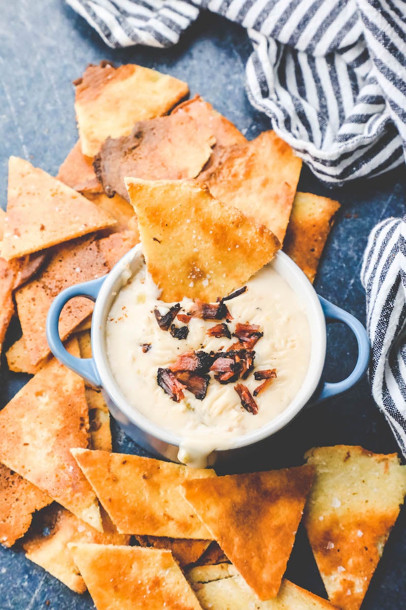 Picture of keto tortilla chips on a plate with dip 