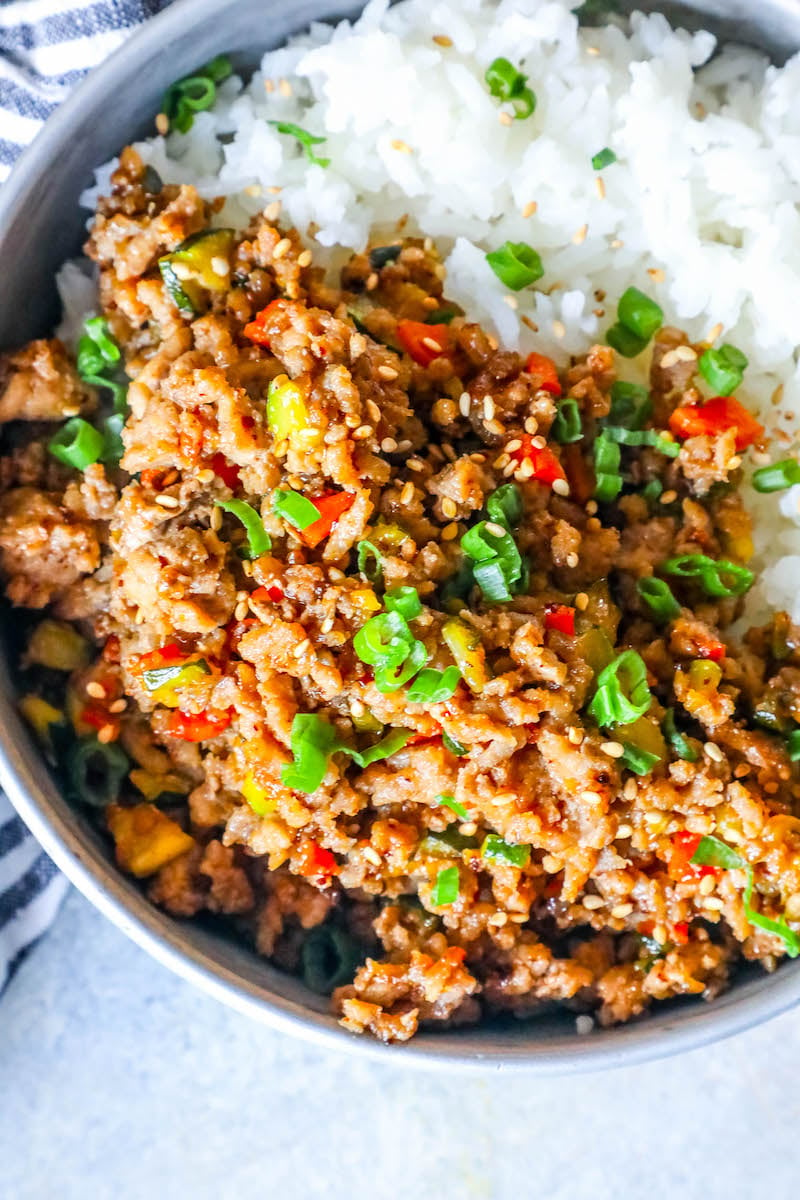 rice in a bowl with ground turkey, green onions, and red bell pepper