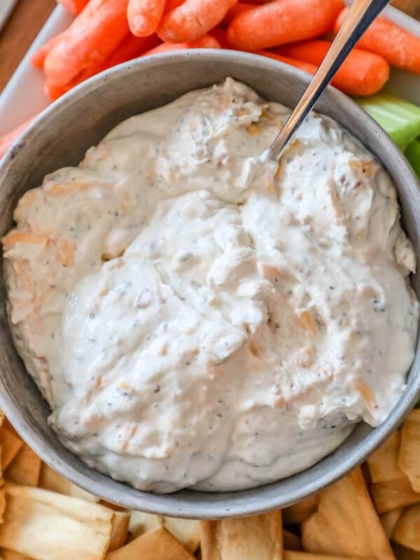 A bacon ranch dip with cheddar, served with carrots and celery.
