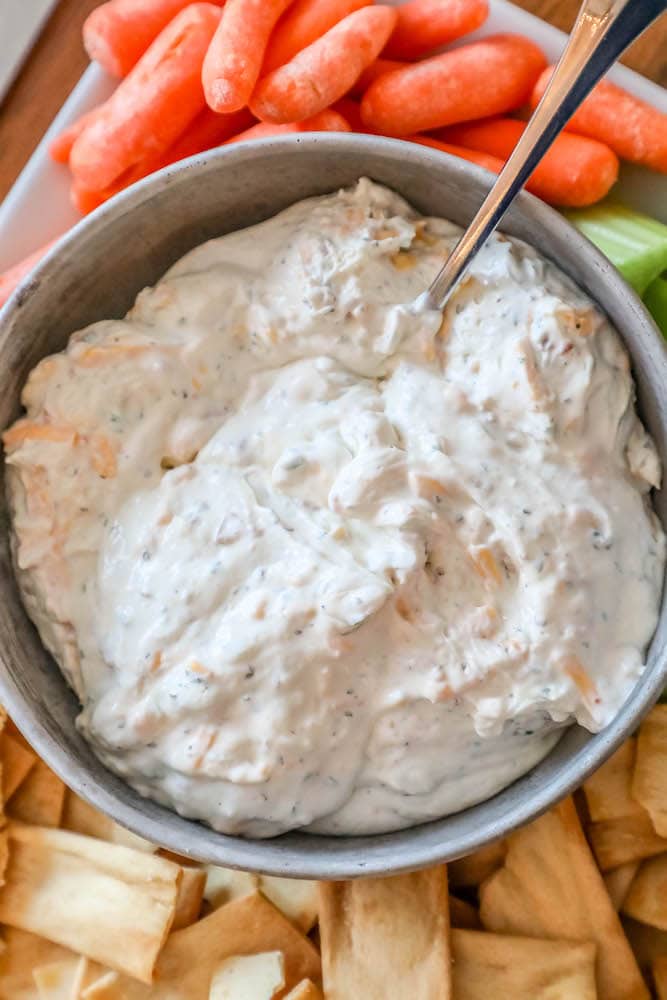 creamy dip with a spoon in it