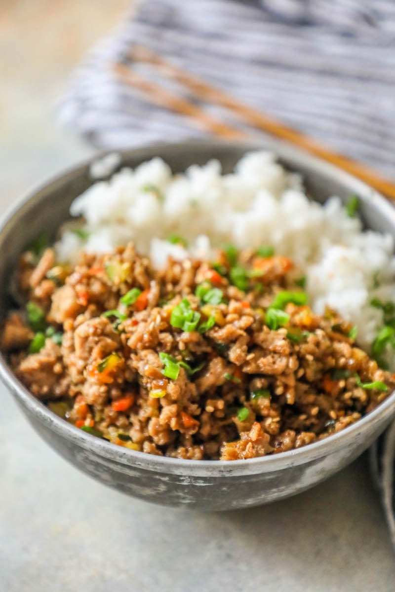 rice in a bowl with ground turkey, green onions, and red bell pepper