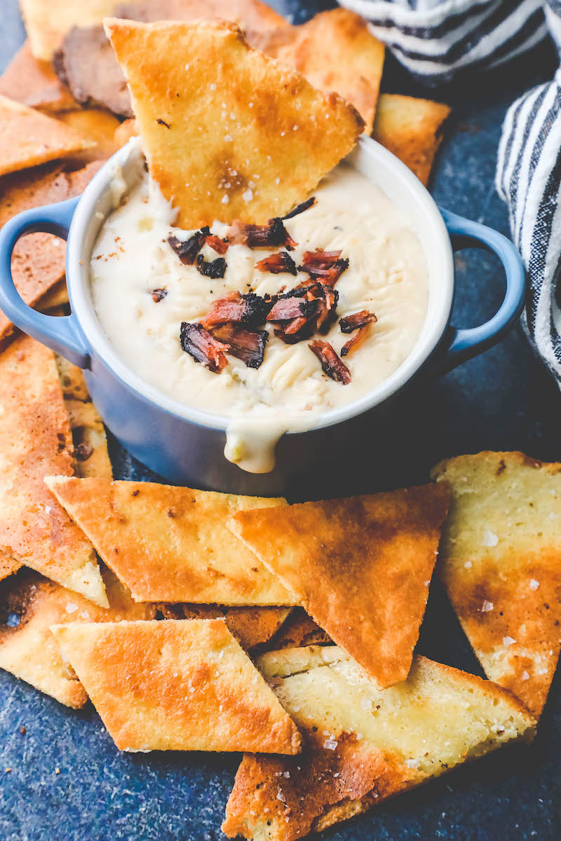 Picture of keto tortilla chips on a plate with dip 