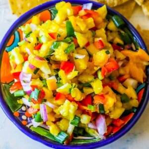 A bowl of easy fruit salsa with tortilla chips.