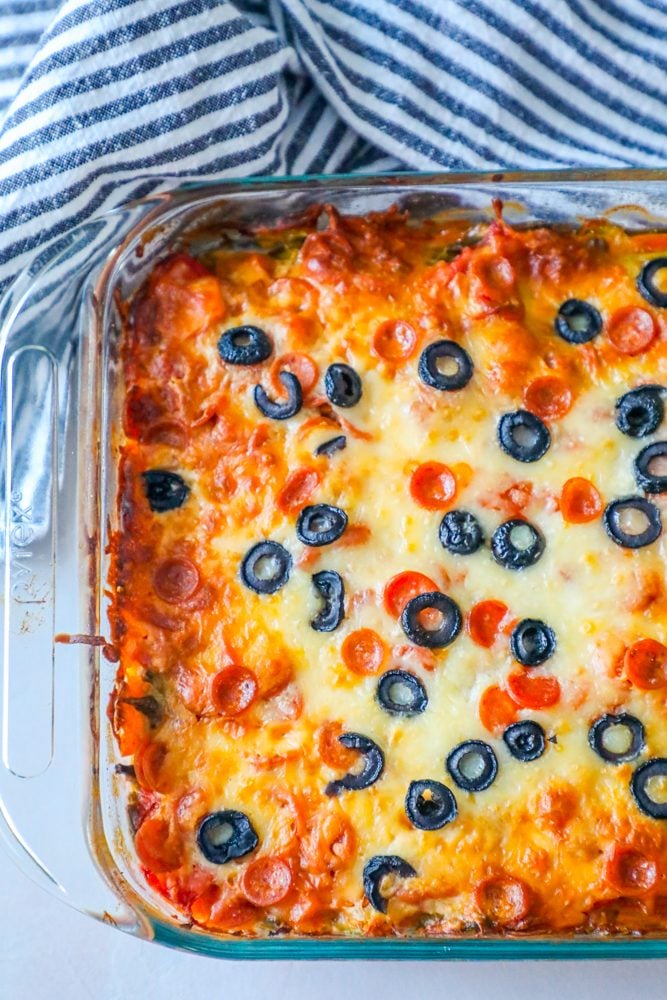 casserole with vegetables and melted cheese and black olives on top