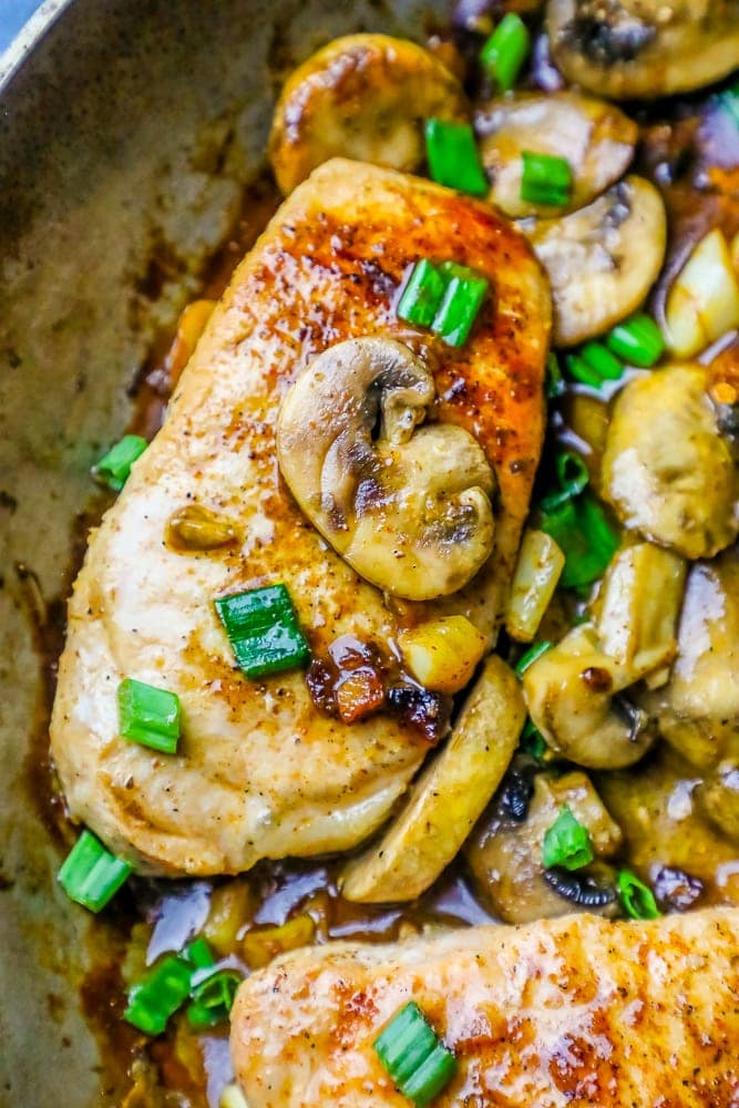pork chops in sauce with mushrooms and green onions
