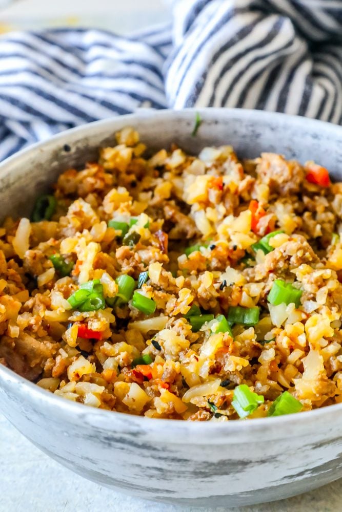 rice, green onions, turkey, peppers, onions in a bowl together