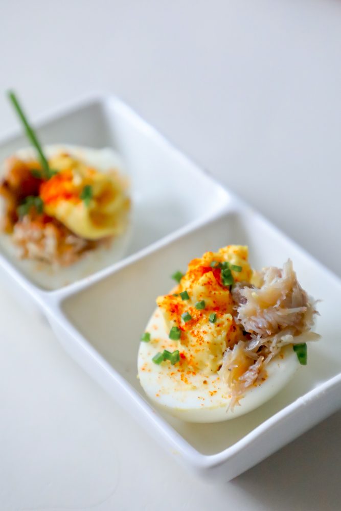 egg with creamed yoke, crab, and green onions on it