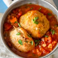 Two meatballs in a bowl with tomato sauce - Mofongo recipe with chicken.