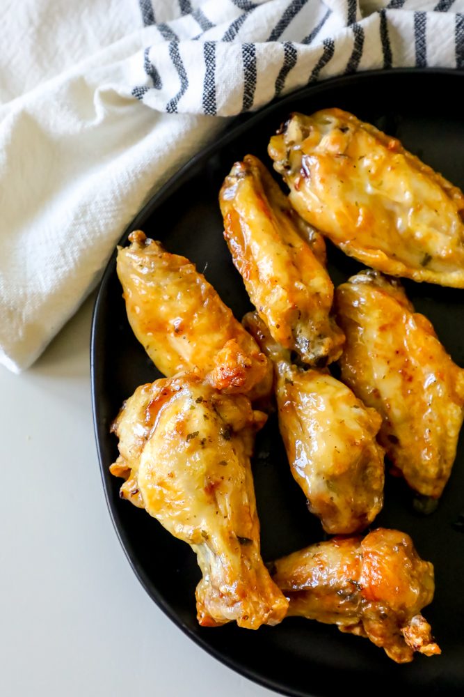 ranch baked wings on a black plate