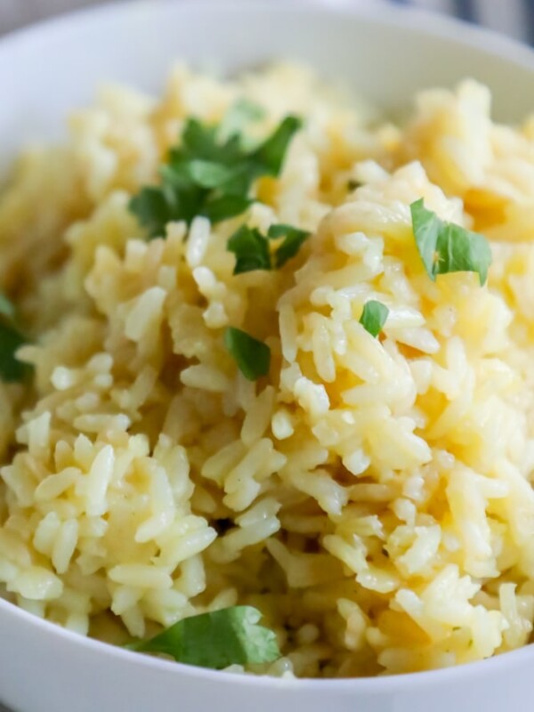 A bowl of rice pilaf with parsley.