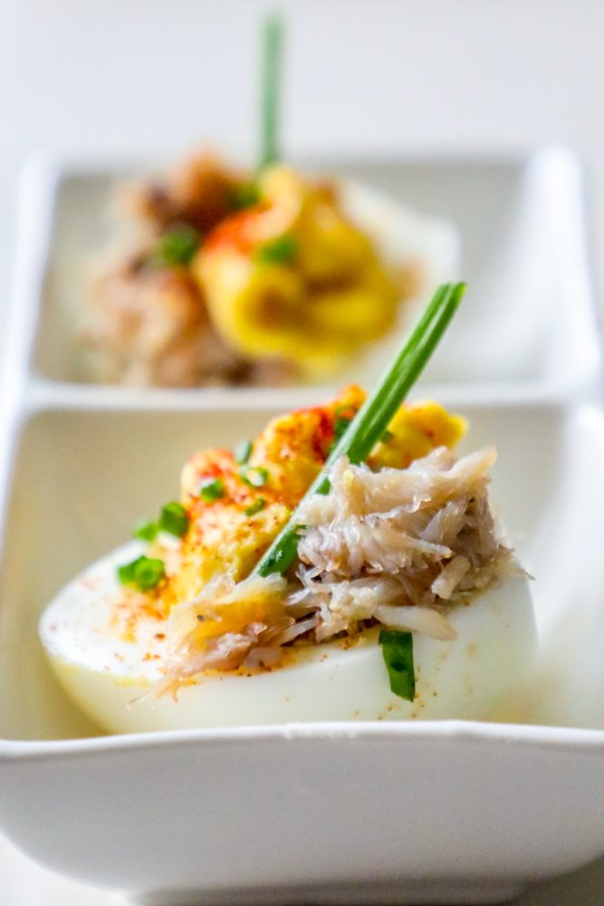 egg with creamed yoke, crab, and green onions on it