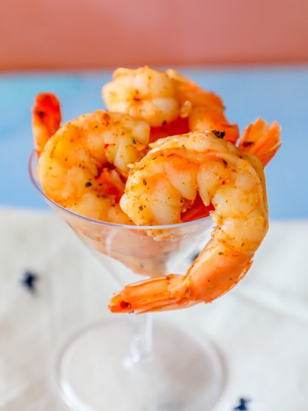 Grilled shrimp seasoned with a spicy Cajun seasoning mix, served in a martini glass.