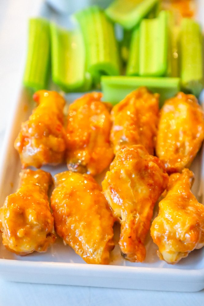 picture of chicken wings and celery on a plate