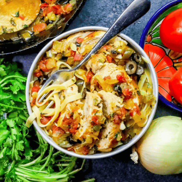 Mexican spicy tequila lime chicken fettuccine soup in a bowl.