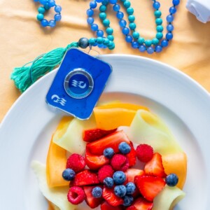 A plate of gluten free fruit with a blue tassel on it.