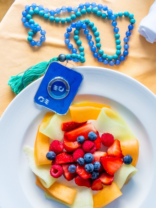 A plate of gluten free fruit with a blue tassel on it.
