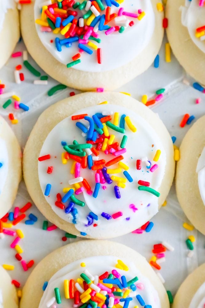 Closeup picture of sugar cookie with bright sprinkles on a table 