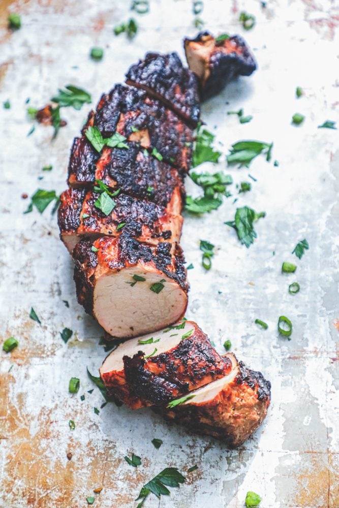 picture of a grilled pork tenderloin with cilantro on top