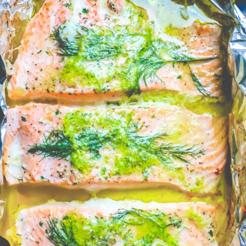 Salmon fillets infused with lemon and dill, baked in foil for an easy Milanese-inspired recipe.