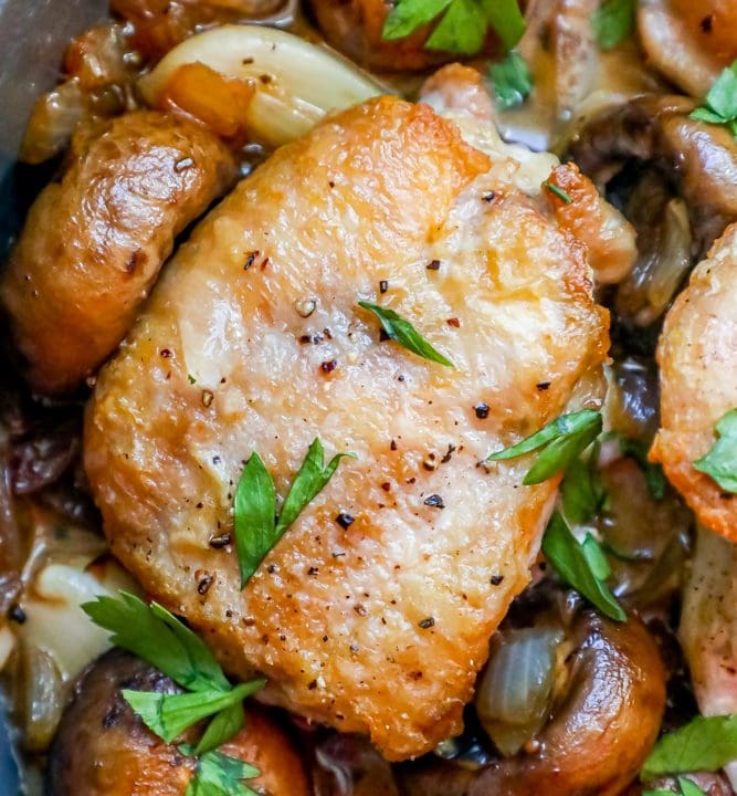 Chicken and mushrooms cooked in a one-pot skillet with a savory garlic butter sauce.