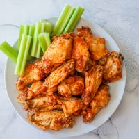 Easy Instant Pot Buffalo Wings with celery sticks.