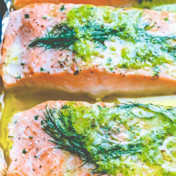 Baked Dill Salmon fillets in foil with a delicious dill sauce.