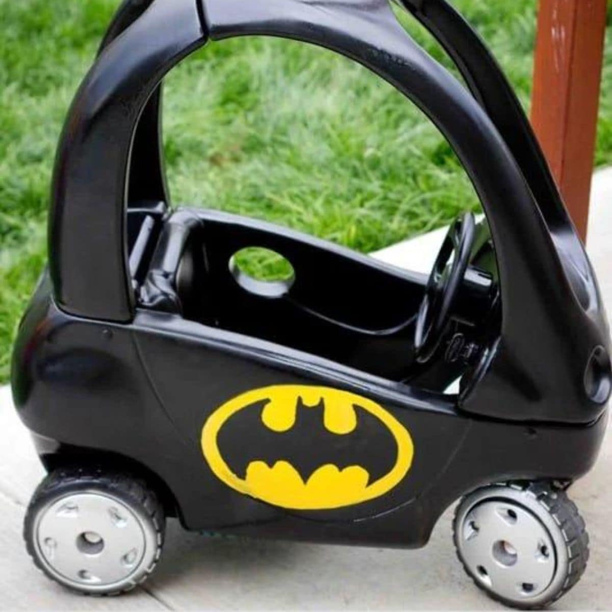 picture of cozy coupe painted to look like a batmobile