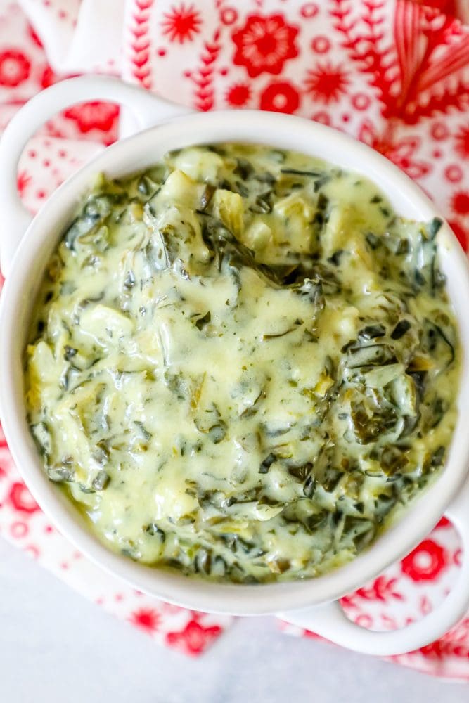 creamed green spinach in a white bowl