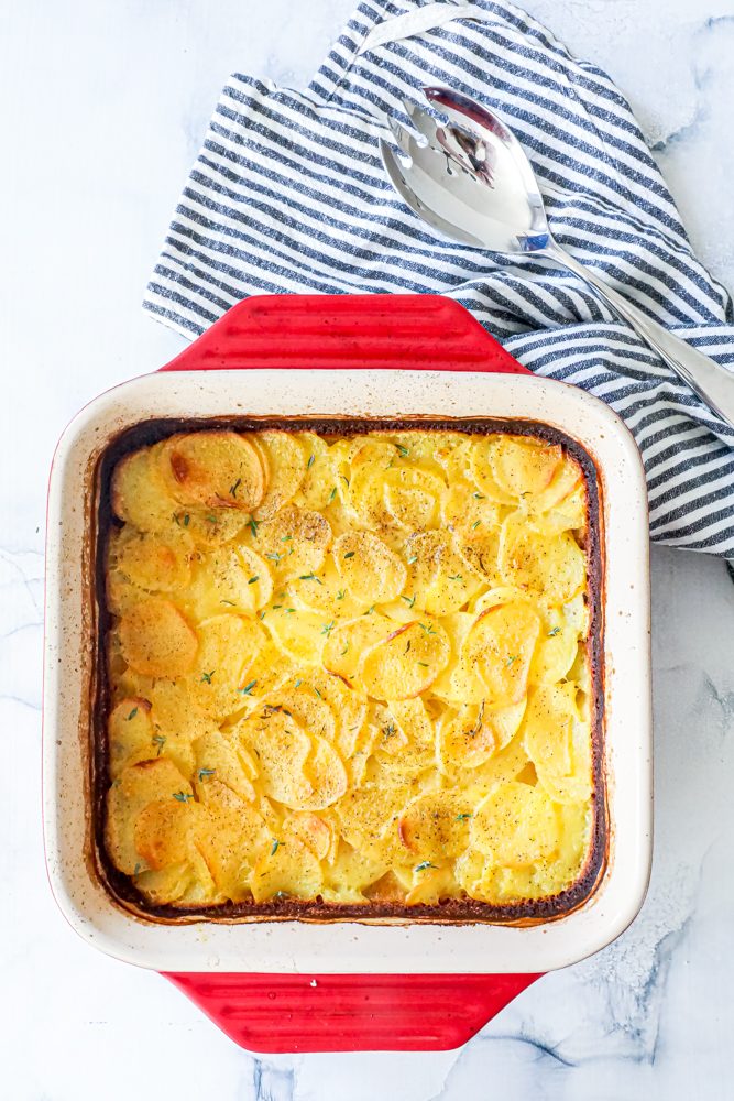 scalloped potatoes in a casserole dish baked